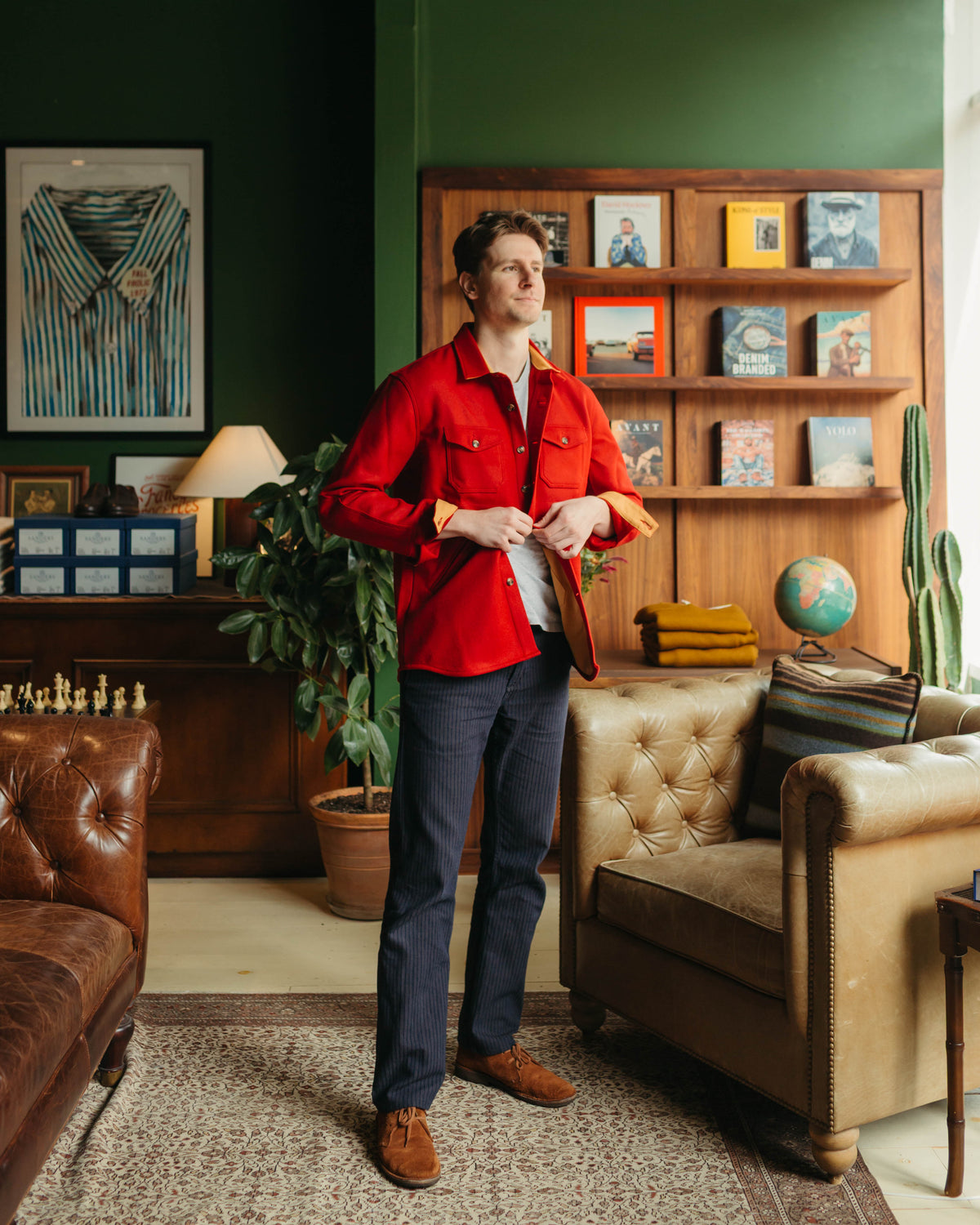 Man in Dehen 1920 Crissman Overshirt in Cardinal adjusting buttons at Fancy Groceries